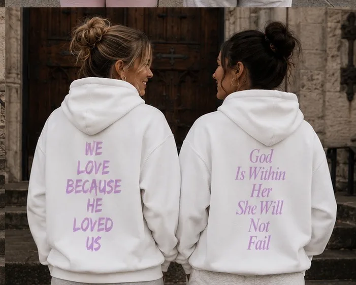 Two women in white DBF hoodies with back graphics